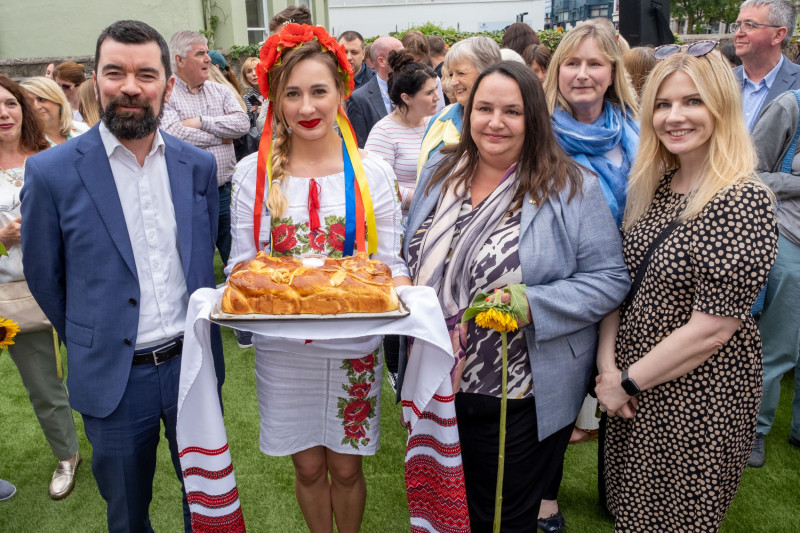 Minister Joe O'Brien and Ukrainian Ambassador being welcomed to launch with Ukrainian bread ceremony