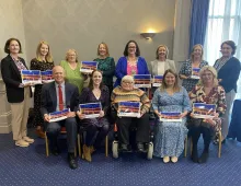 Members of DISC posing for photo holding copies of the strategy.